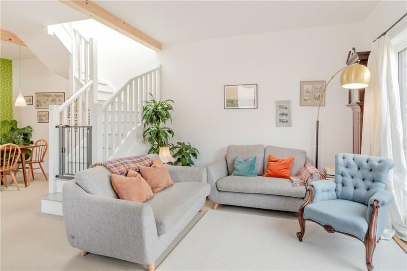 The reception or sitting room, with the open staircase to the rear.