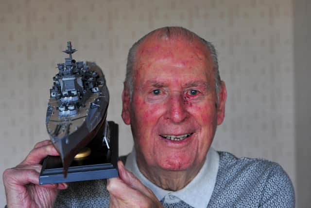 The late Harrogate D Day hero Maurice Hammond pictured with a model of HMS Warspite, the Royal Naval ship he served on in the Second World War.