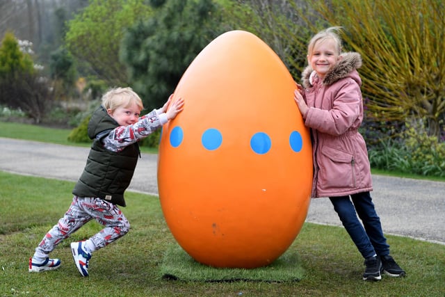 Three-year-old Monty Sebo and his sister, six-year-old Alice Sebo, with one of the giant eggs at RHS Garden Harlow Carr in 2022