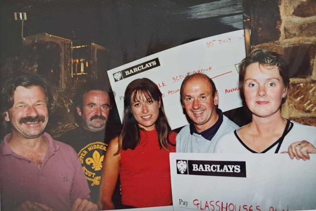 The event team presenting an over-sized cheque at one of the successful fundraising events with help from now retired Leeds United Physio - Alan Sutton.
