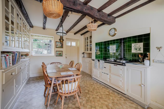 The fitted breakfast kitchen has an Aga and a walk-in pantry.