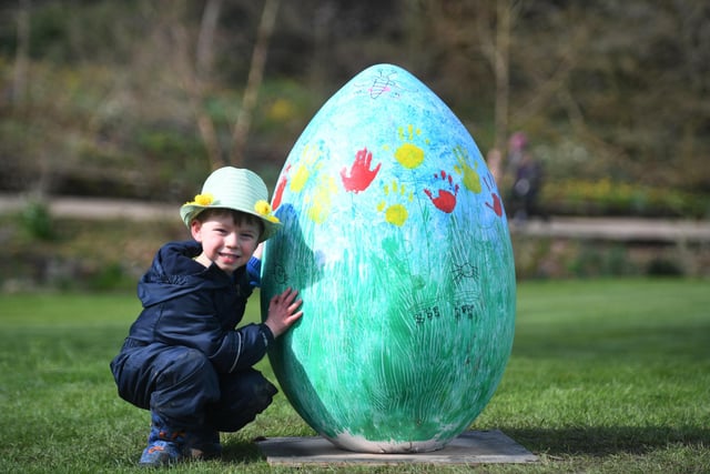Four-year-old Teddy West in his Easter hat with one of the giant eggs