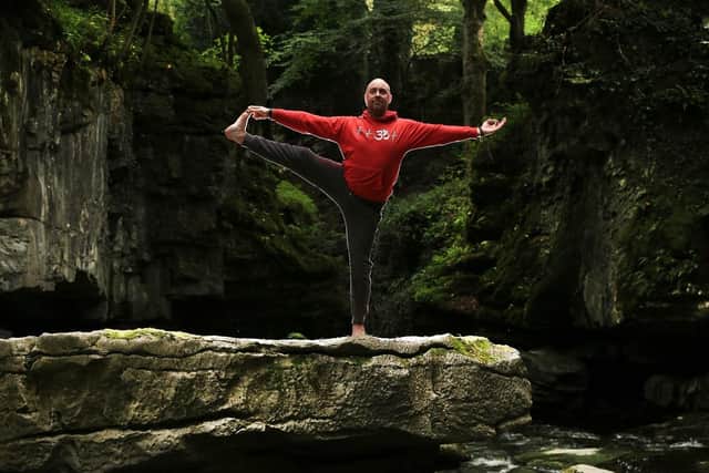Yoga teacher Matt Tottman at How Stean Gorge , Lofthouse, North Yorkshire.
