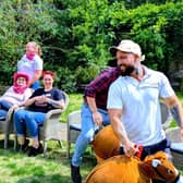 Residents and staff enjoying the wild west horse racing