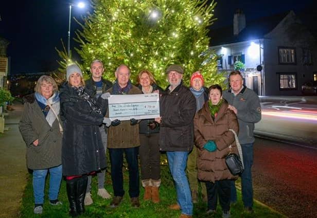 The donation to the Harrogate-based suicide prevention charity by volunteer members of Kirk Deighton Events followed a successful Christmas lights switch-on in the village. (Picture contributed)