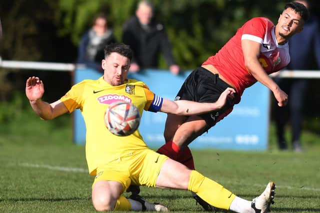Tadcaster Albion captain Dan Thirkell flies into a challenge against his old club.