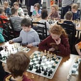 Children participating in junior chess tournament.