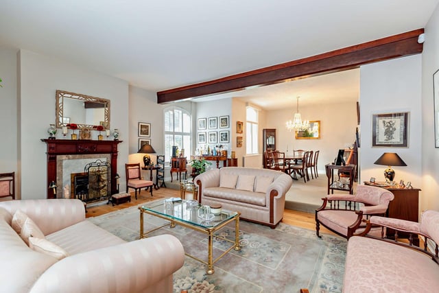 The split level lounge and dining room, with a living flame gas fire and feature fireplace.
