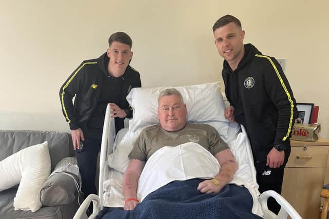 Harrogate Town footballers Jack Muldoon and Mathew Foulds, with Dave, one of the patients at Saint Michael’s Hospice in Harrogate. (Picture contributed)