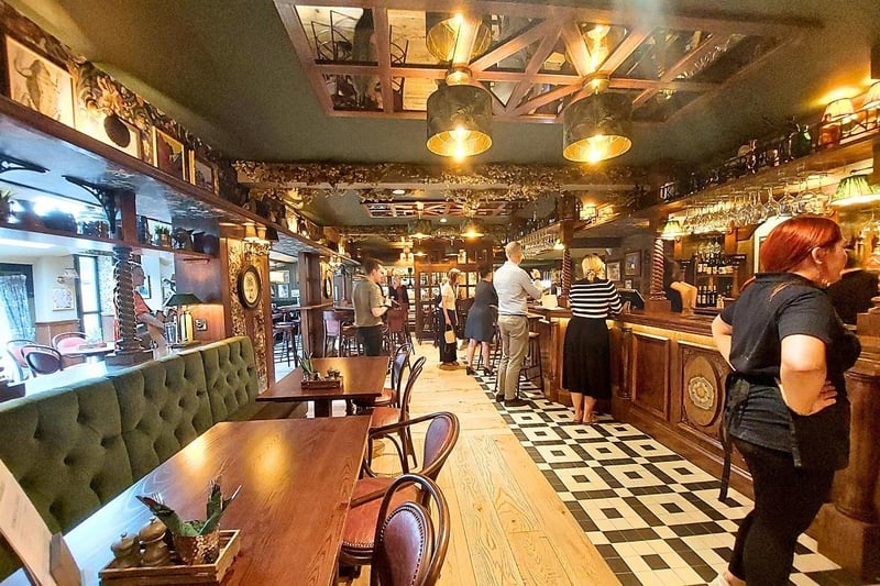 After its refurbishment, the bar was extended, the seating area is now partially separated by richer wood texture pillars and the decor used is now eclectic.