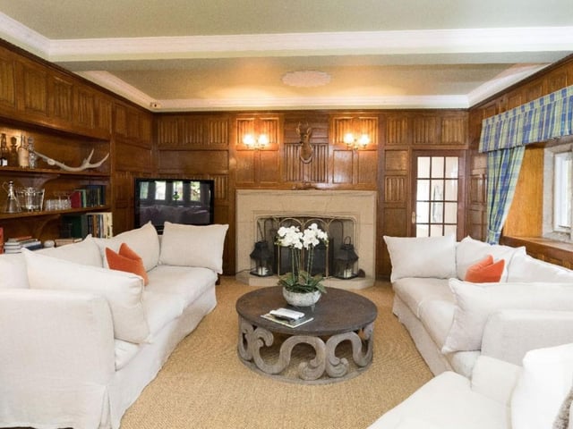 Another one of the estates living areas with bespoke fireplace and charming period features.