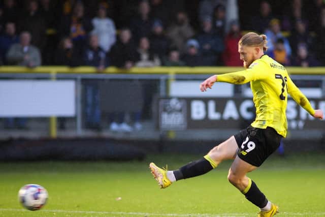 Luke Armstrong fires home his first goal of the game during Harrogate Town's 3-0 success over Mansfield Town.