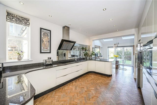 An extended, open plan kitchen and diner has bi-folding doors to the rear garden.