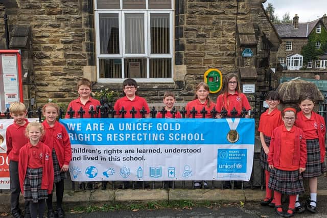 Rare honour for Harrogate district school - Children from Glasshouses Community Primary School with the new GOLD UNICEF banner. (Picture contributed)