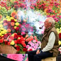 Geoff Gardener, Chairman of the Northern Committee of the National Dahlia Society, takes a break with his pipe