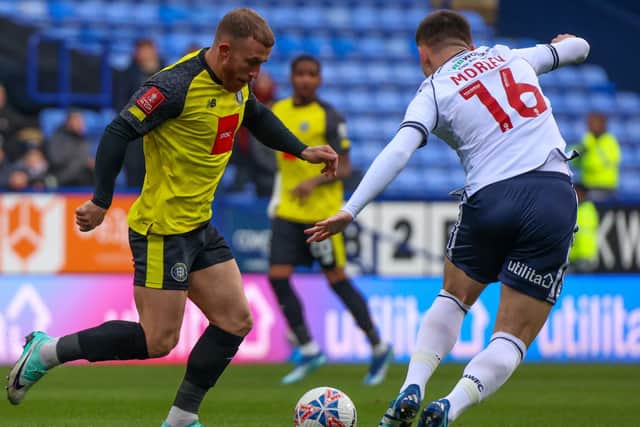 George Thomson in action for Harrogate Town during Saturday's 5-1 FA Cup defeat at Bolton Wanderers. Pictures: Matt Kirkham