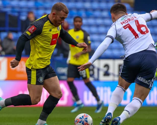 George Thomson in action for Harrogate Town during Saturday's 5-1 FA Cup defeat at Bolton Wanderers. Pictures: Matt Kirkham