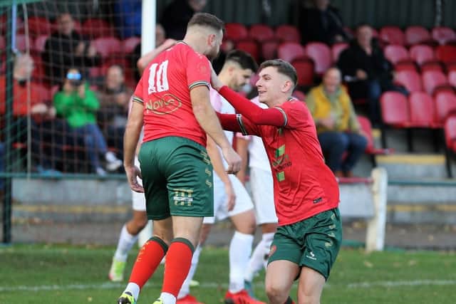 Jack Lazenby, right, celebrates with team-mate Fatlum Ibrahimi after the latter back-heeled Harrogate Railway into a 28th-minute lead against Selby Town.