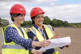 Councillor Helen Hayden (Leeds City Council’s executive member for children and families) and Councillor Salma Arif (Leeds City Council’s executive member for adult social care, active lifestyles and culture) at the Whinmoor Grange site where two new football pitches are taking shape