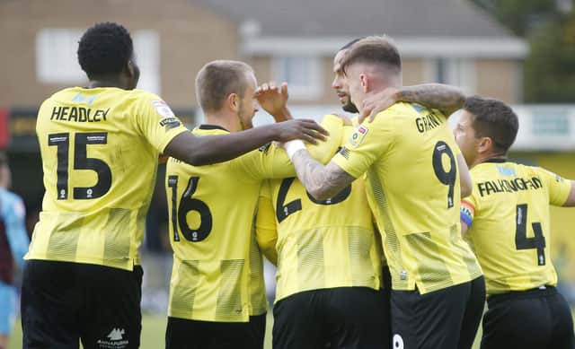 Harrogate Town players celebrate after Matty Daly fired them into a first-half lead against Tranmere Rovers. Pictures: Paul Thompson