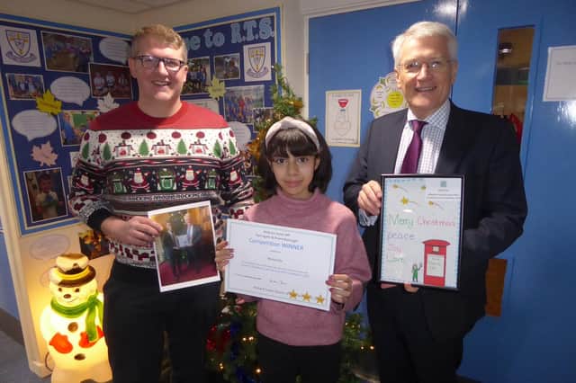 Christmas card design competition - Harrogate and Knaresborough MP Andrew Jones, with Richard Taylor School winning pupil Misha and Richard Taylor headteacher Andrew Symonds