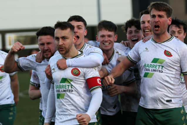 Harrogate Railway's players celebrate after Dan McDaid, second from left, netted a second-half winner against Selby Town. Picture: Craig Dinsdale
