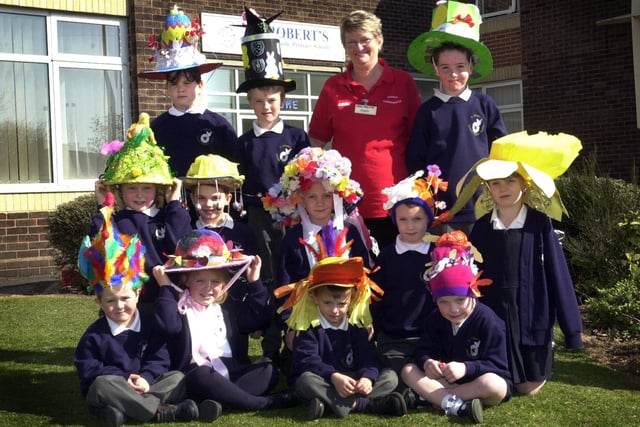 Easter bonnets at St Robert's RC School in Harrogate in 2003. Pictured with Angela Smith of ASDA are Daniel Horne, Lizzie Cunningham, Declan Brotheridge, Rachel Philp, Joe Porritt, Luke Ingle-Simpson, Nancy Payne, David Cunningham, Jennifer Brown, Liam Gaffney, Dillon Steele and Siobhan Pywell