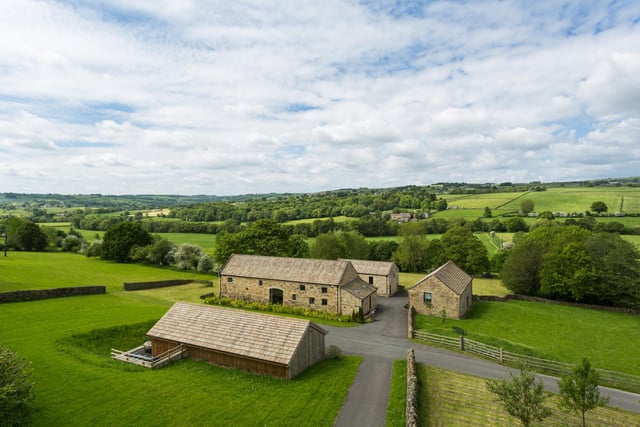 A wider view of the property and the surrounding countryside.