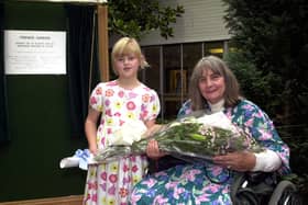 Helping others -  Baroness Masham receives a bouquet at the opening of the Friends Garden at Harrogate District Hospital in 2001. (Picture Steve Race)