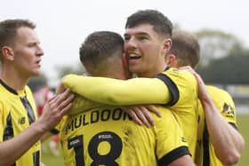 Ellis Taylor takes the congratulations of his Harrogate Town team-mates after putting them 2-1 up against Fleetwood. Pictures: Paul Thompson/ProSportsImages