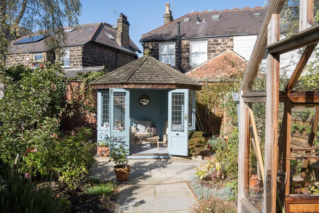 A perfect bolt hole - this Amdega summer house sits at the bottom of the garden.