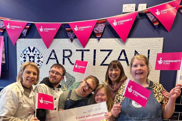 Whopping cash boost - Staff at Artizan International's Harrogate café celebrate their National Lottery funding. (Picture contributed)
