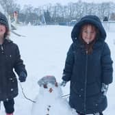 Connie and Heidi Osborne having lots of fun in the snow this morning