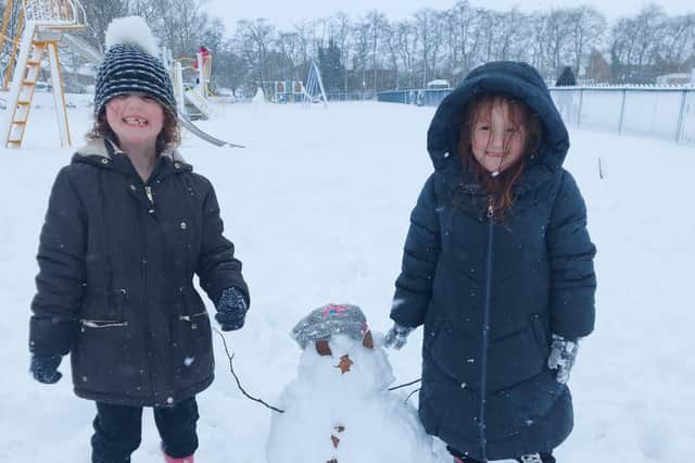 Connie and Heidi Osborne having lots of fun in the snow this morning