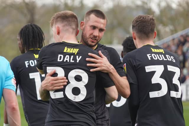 Joe Mattock congratulates Matty Daly on his 39th-minute strike put Harrogate Town 2-0 up against Mansfield Town. Pictures: Brody Pattison