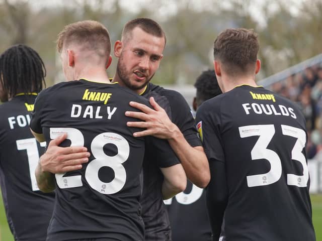 Joe Mattock congratulates Matty Daly on his 39th-minute strike put Harrogate Town 2-0 up against Mansfield Town. Pictures: Brody Pattison