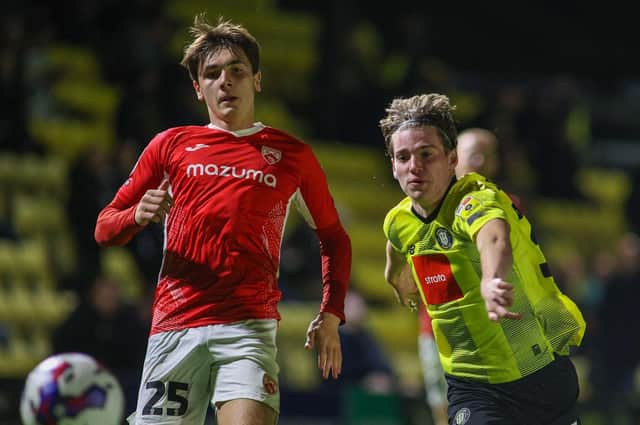 Harrogate Town midfielder Finn O'Boyle chases the ball down during Tuesday night's EFL Trophy Group A success over Morecambe. Pictures: Matt Kirkham