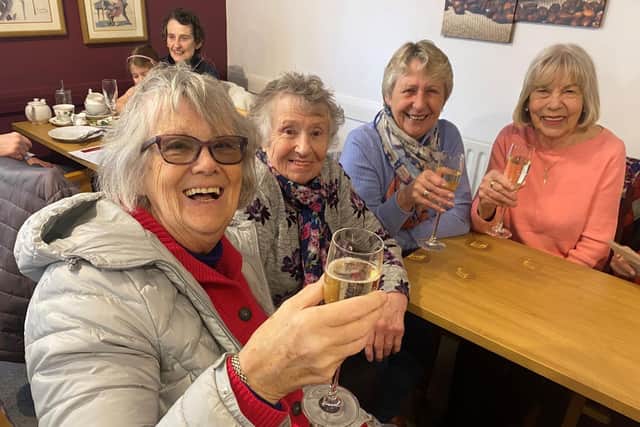 Customers enjoyed a free glass of fizz and a piece of cake to celebrate ten years of the Wetherby in Support of the Elderly Owl Cafe