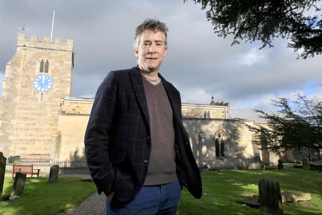 Distinguished Harrogate jeweller Robert Ogden is also Artistic Director of the Northern Aldborough Festival. Here he stands outside St Andrew's Church in Aldborough, the festival’s principle venue. (Picture contributed)