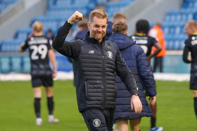 Sulphurites boss Simon Weaver celebrates in front of the travelling Harrogate supporters.