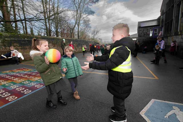 Unlocking pupils' potential - Alfie Wilkinson plays with Dotty Walker and Dylan-Lloyd Clarke in the playground of Beckwithshaw Community Primary School, Harrogate.  (Picture contributed)