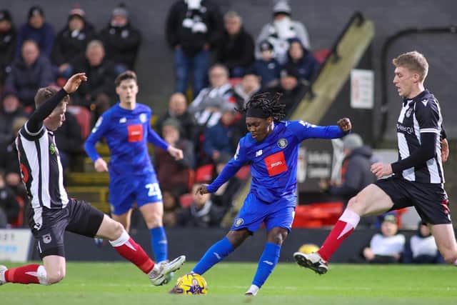 Abraham Odoh takes aim at the Grimsby goal.