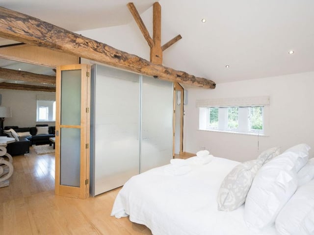 One of the six bedrooms available for large families or guests with its own living space.