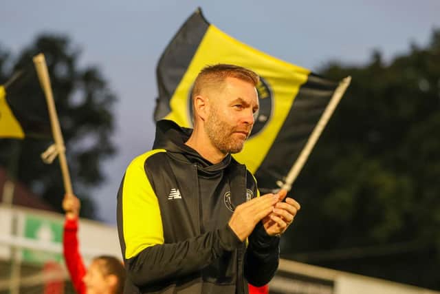 Harrogate Town manager Simon Weaver takes to the EnviroVent Stadium pitch ahead of Tuesday night's League Two showdown with Salford City.