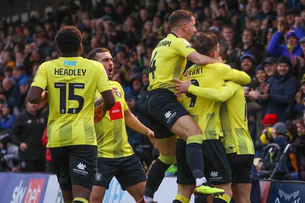 Harrogate Town's players celebrate after Alex Pattison fired them into a fifth-minute lead against Mansfield Town. Pictures: Matt Kirkham