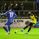 Harrogate Town forward Abraham Odoh takes aim at the Carlisle United goal during Tuesday night's EFL Trophy clash at Brunton Park. Pictures: Matt Kirkham