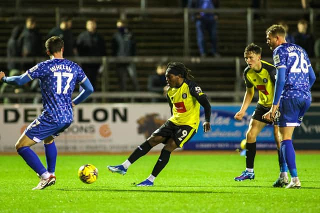 Harrogate Town forward Abraham Odoh takes aim at the Carlisle United goal during Tuesday night's EFL Trophy clash at Brunton Park. Pictures: Matt Kirkham