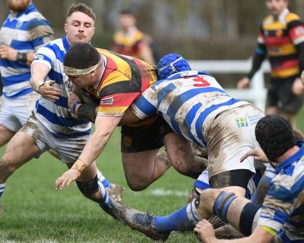 Harrogate RUFC's Jacob Percival is halted by a trio of Tynedale players during Saturday's National Two North clash at Rudding Lane. Pictures: Gerard Binks