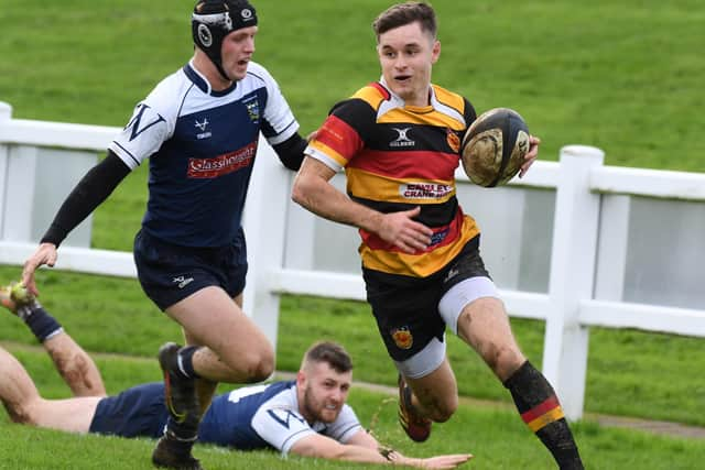 Harrogate's Conor Miller closes in on the try line.