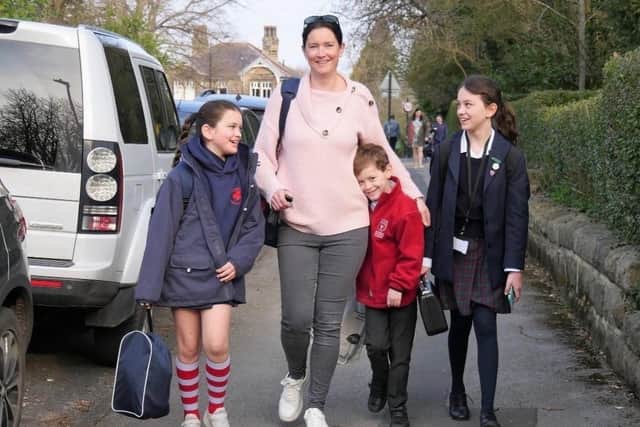 The late Mrs Philippa Badger (centre), who died unexpectedly a year ago of leukaemia, with children,  Alice, Thomas and Isabel.